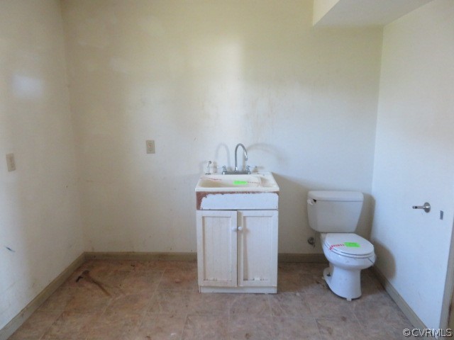 15212 Wilkinson Road Dinwiddie, VA 23841 - Photo 29 of 46 a bathroom with a granite countertop toilet and a sink