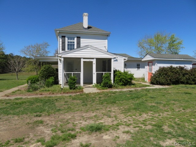 15212 Wilkinson Road Dinwiddie, VA 23841 - Photo 3 of 46 a front view of a house with a yard