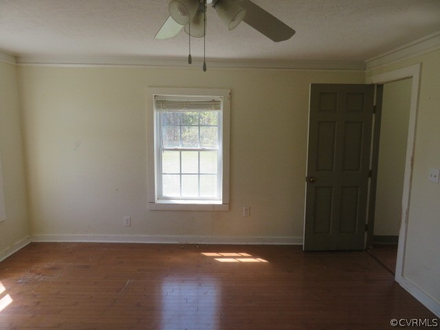 15212 Wilkinson Road Dinwiddie, VA 23841 - Photo 45 of 46 an empty room with wooden floor fan and windows