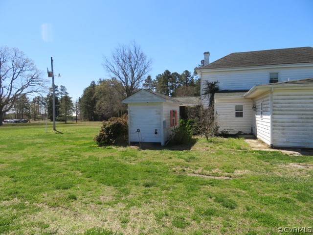 15212 Wilkinson Road Dinwiddie, VA 23841 - Photo 7 of 46 a view of a house with a backyard