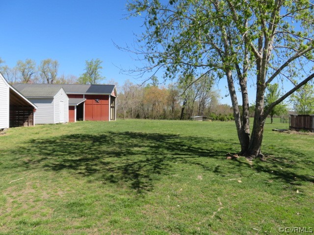 15212 Wilkinson Road Dinwiddie, VA 23841 - Photo 9 of 46 a view of a house with a big yard