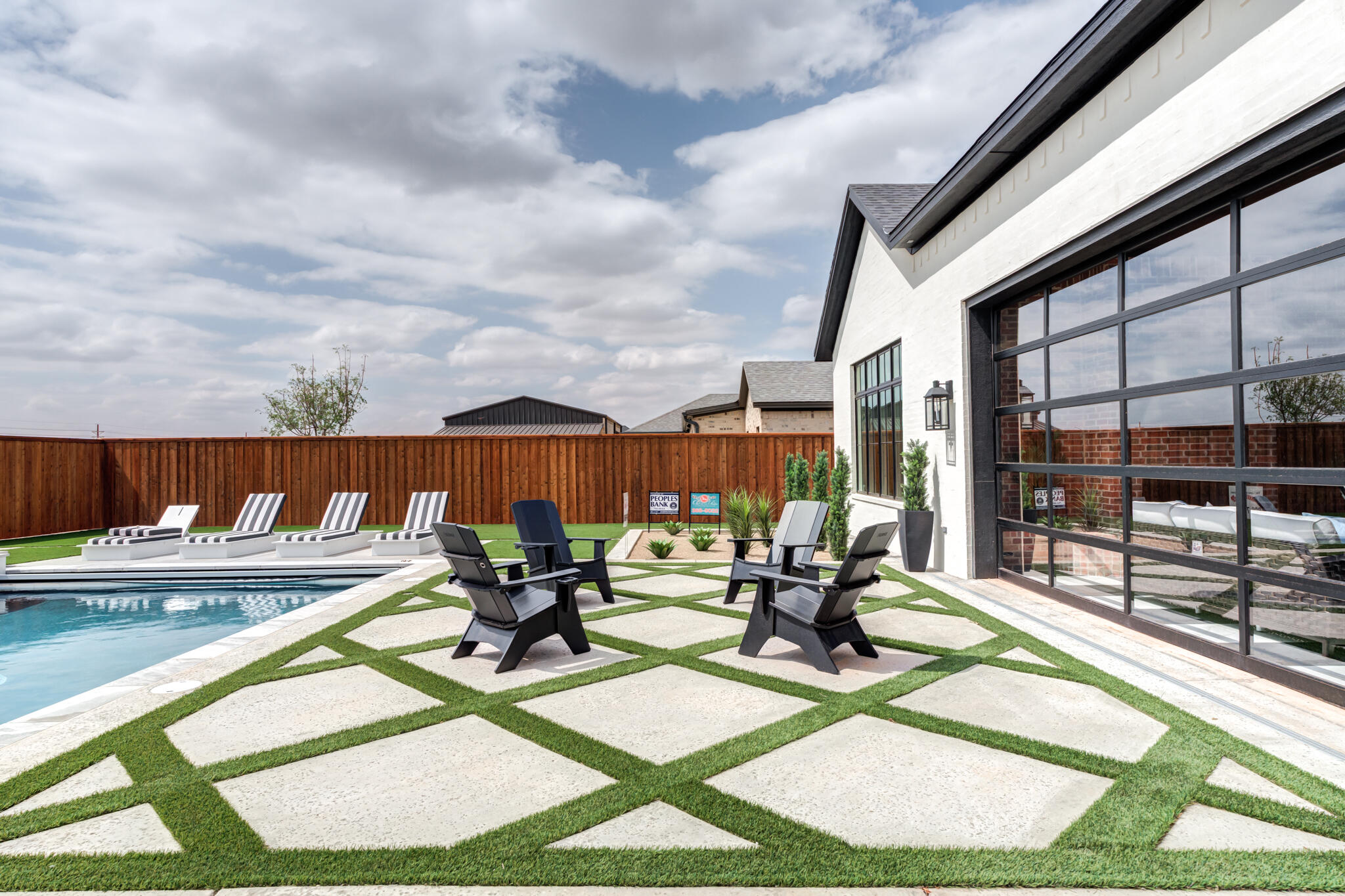 4510 Zadar Avenue Lubbock, TX 79407 - Photo 131 of 142 a view of swimming pool with seating area and furniture in the background