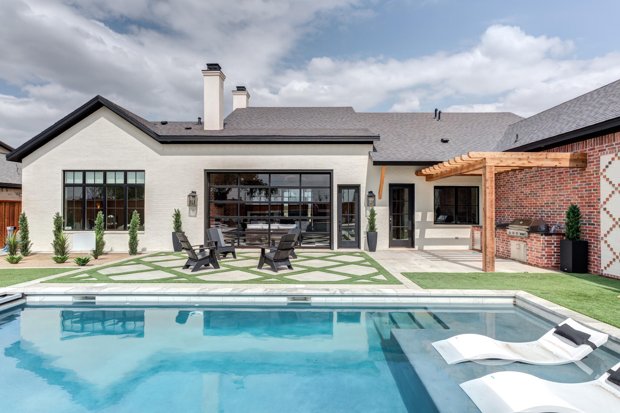 4510 Zadar Avenue Lubbock, TX 79407 - Photo 136 of 142 a view of a house with swimming pool and sitting area