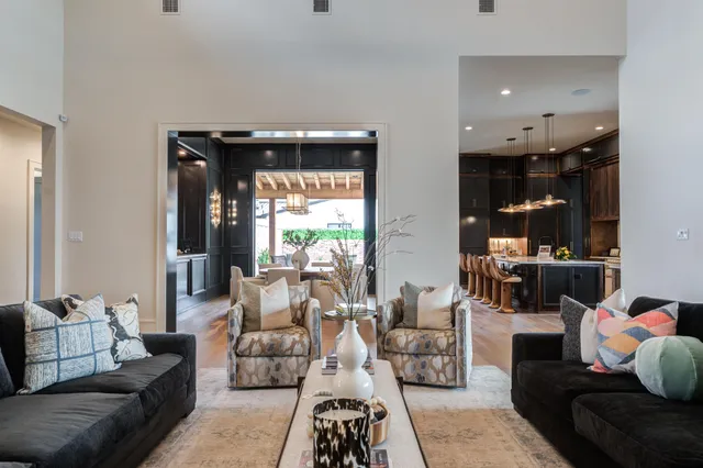 a bedroom with bed and a mirror