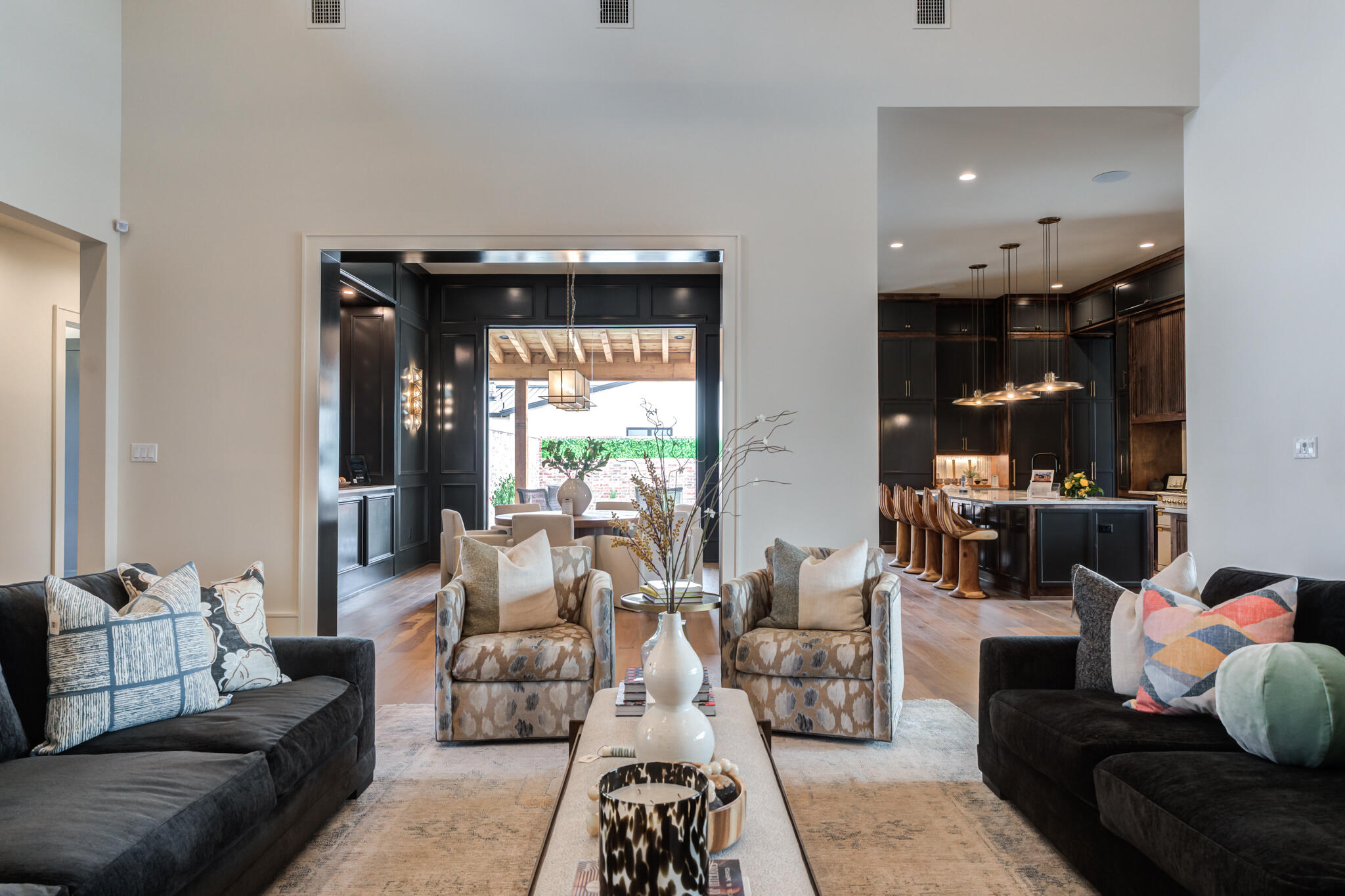 4510 Zadar Avenue Lubbock, TX 79407 - Photo 25 of 142 a living room with furniture and a chandelier