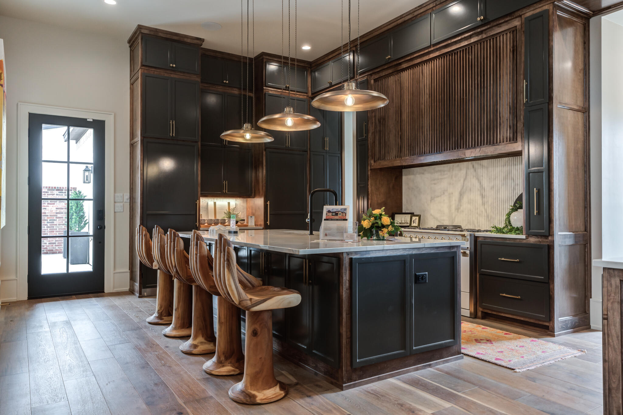 4510 Zadar Avenue Lubbock, TX 79407 - Photo 37 of 142 a kitchen with stainless steel appliances granite countertop a refrigerator a sink dishwasher a dining table and chairs with wooden floor