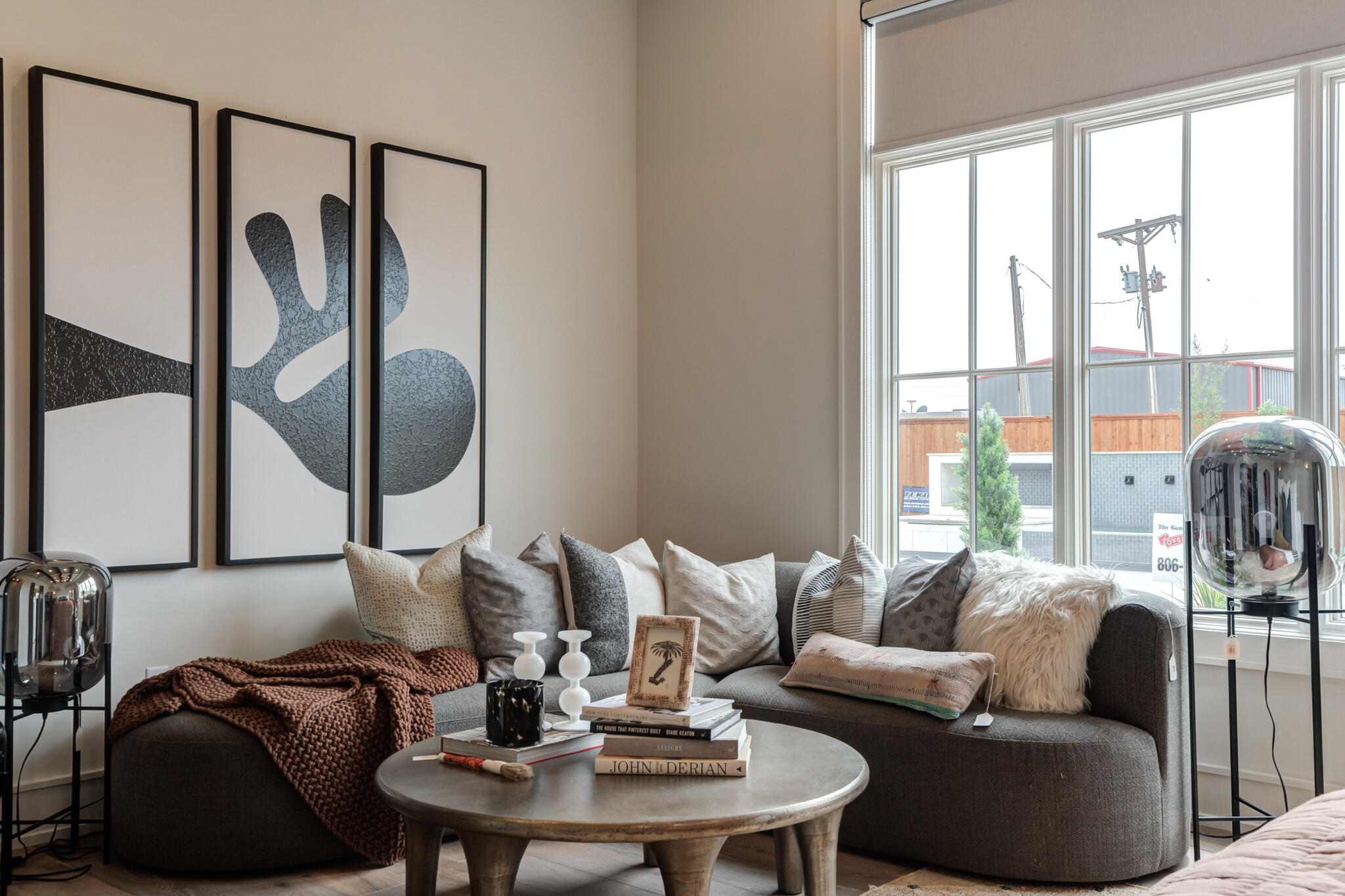 4510 Zadar Avenue Lubbock, TX 79407 - Photo 62 of 142 a living room with furniture and a floor to ceiling window