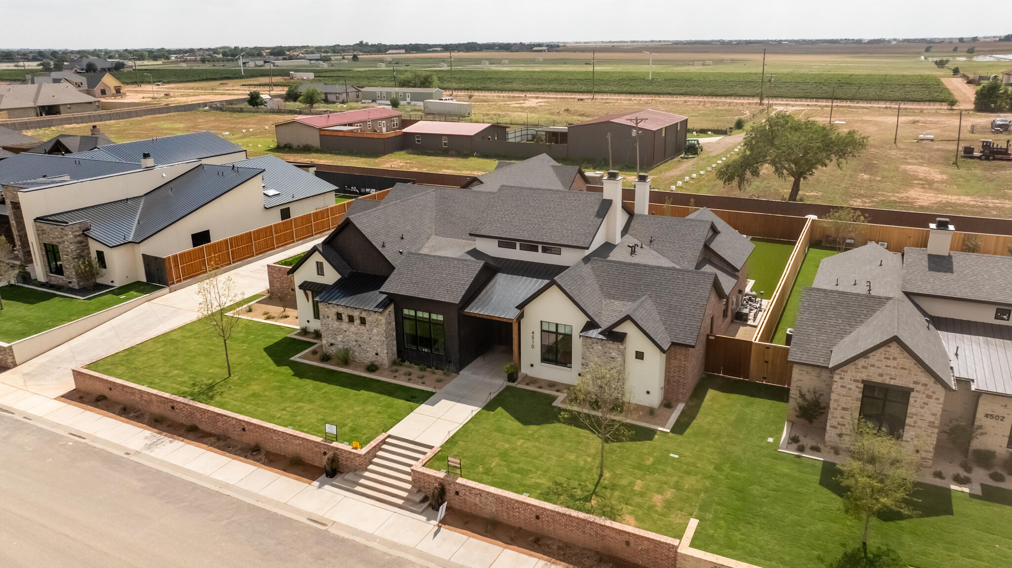 4510 Zadar Avenue Lubbock, TX 79407 - Photo 7 of 142 an aerial view of residential houses with outdoor space and ocean view