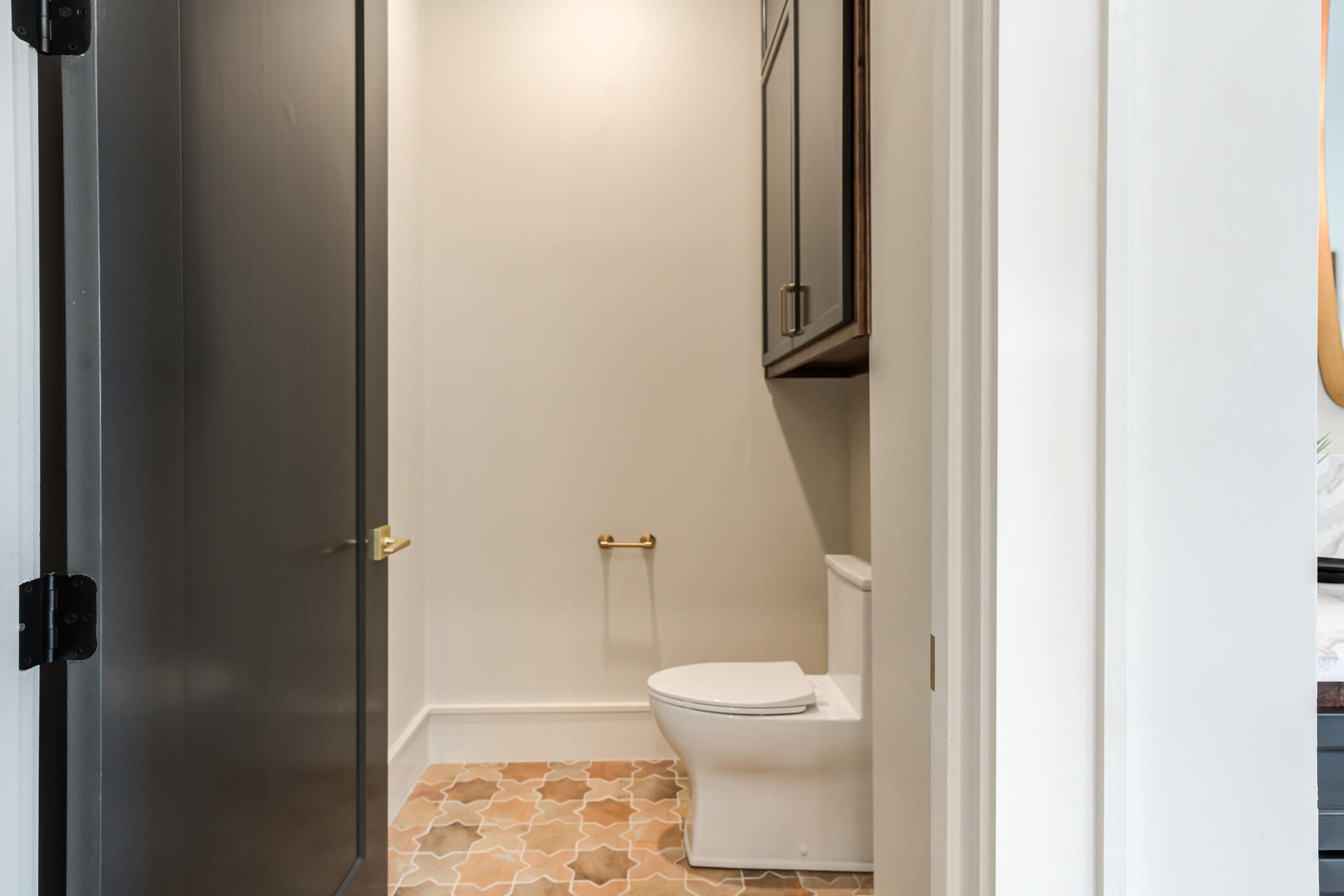4510 Zadar Avenue Lubbock, TX 79407 - Photo 71 of 142 a white toilet sitting next to a bathroom sink
