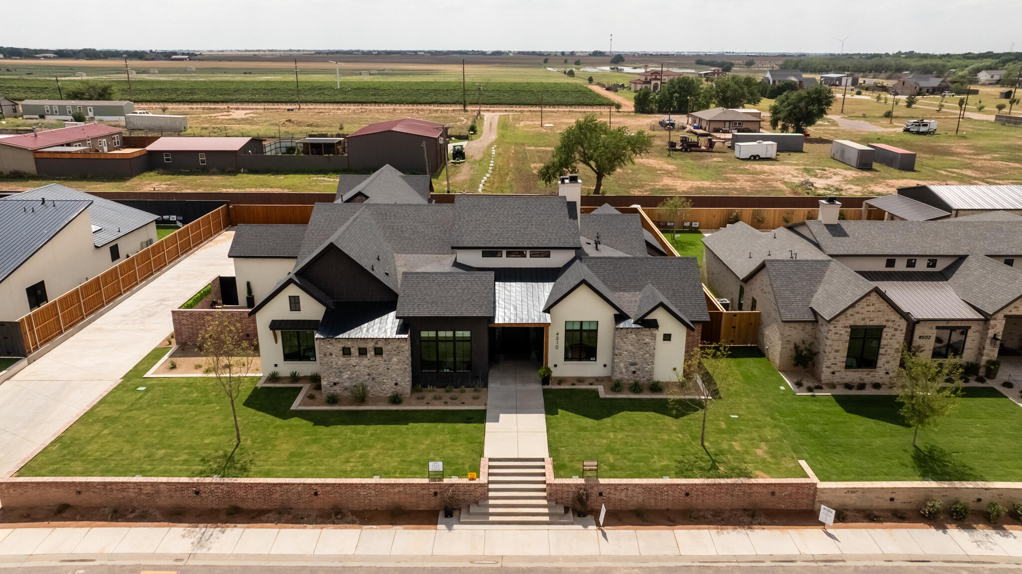 4510 Zadar Avenue Lubbock, TX 79407 - Photo 8 of 142 an aerial view of a house with a yard pool and outdoor seating
