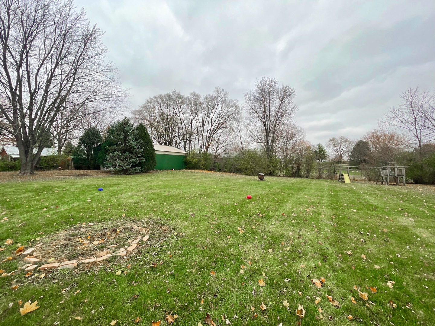 3214 Stieg Road Woodstock, IL 60098 - Photo 17 of 20 a view of a grassy field with trees