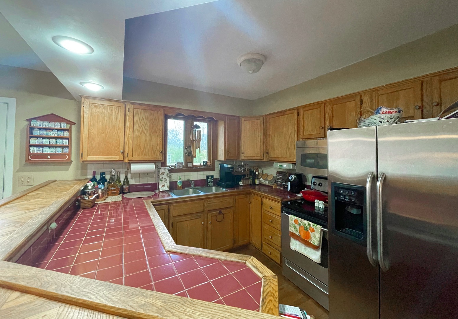 3214 Stieg Road Woodstock, IL 60098 - Photo 6 of 20 a kitchen with a sink appliances and cabinets