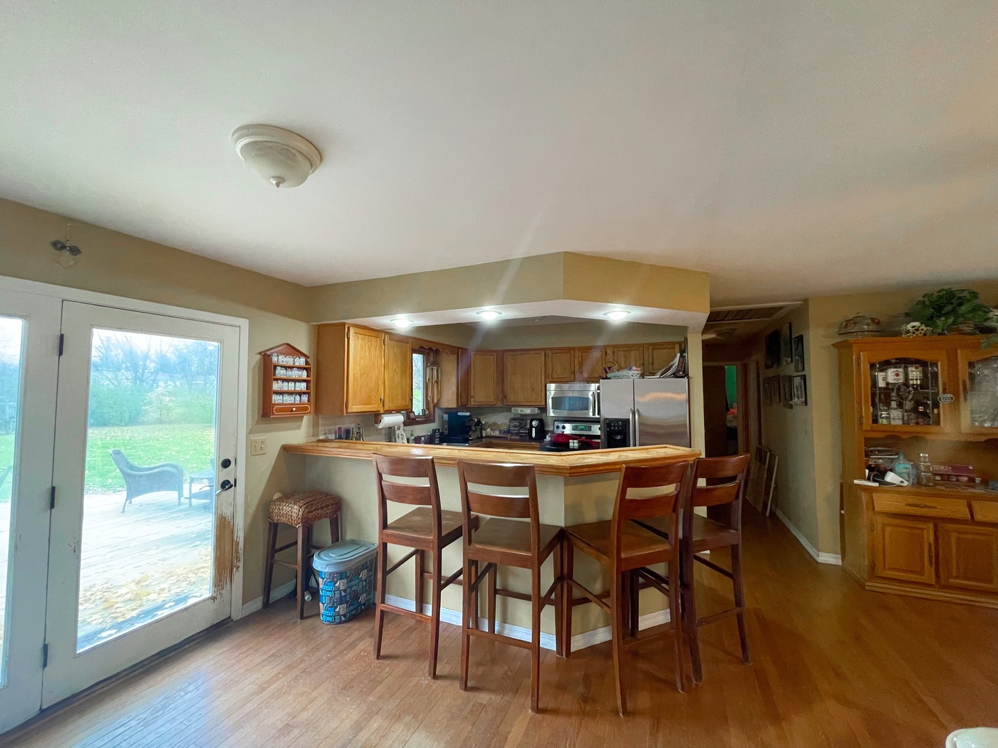 3214 Stieg Road Woodstock, IL 60098 - Photo 7 of 20 a dining room with furniture a rug and wooden floor