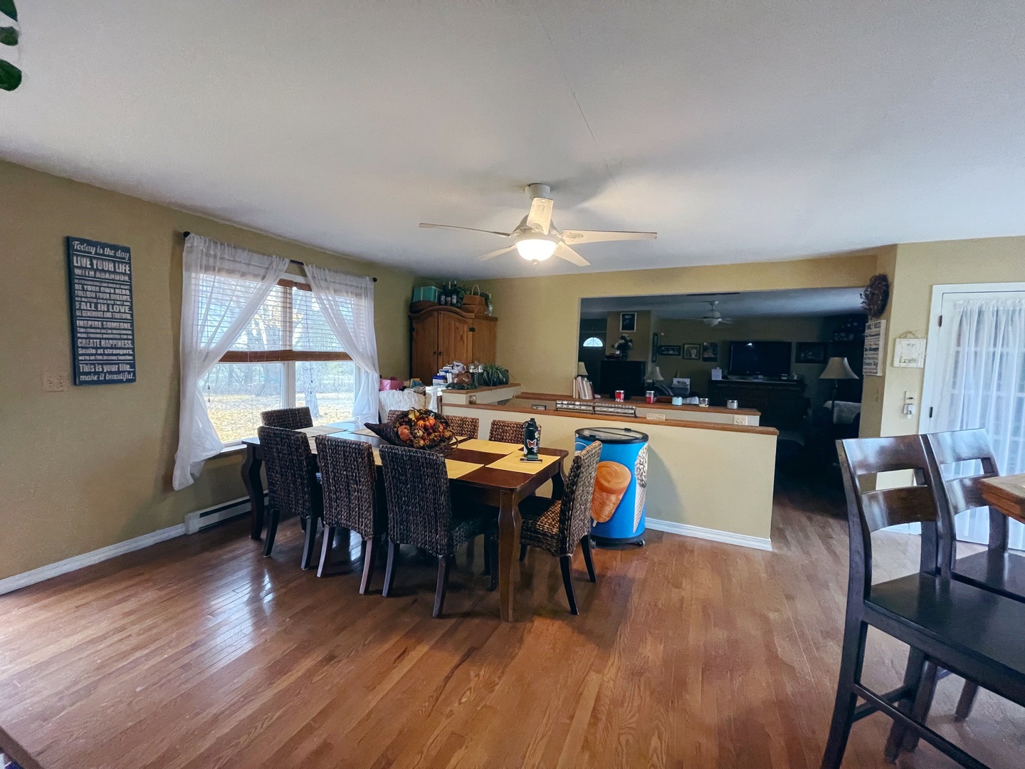 3214 Stieg Road Woodstock, IL 60098 - Photo 8 of 20 a view of a dining room with furniture window and wooden floor