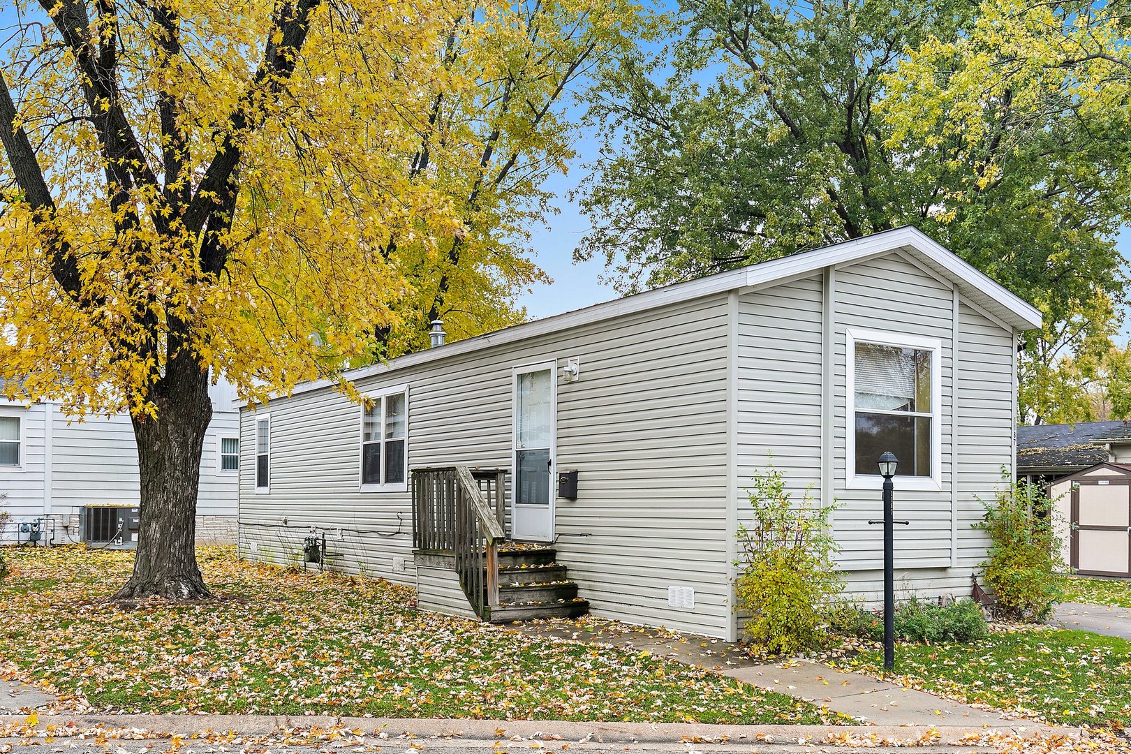 1187 Lakewood Road Elgin, IL 60123 - Photo 2 of 21 a view of a house with a backyard