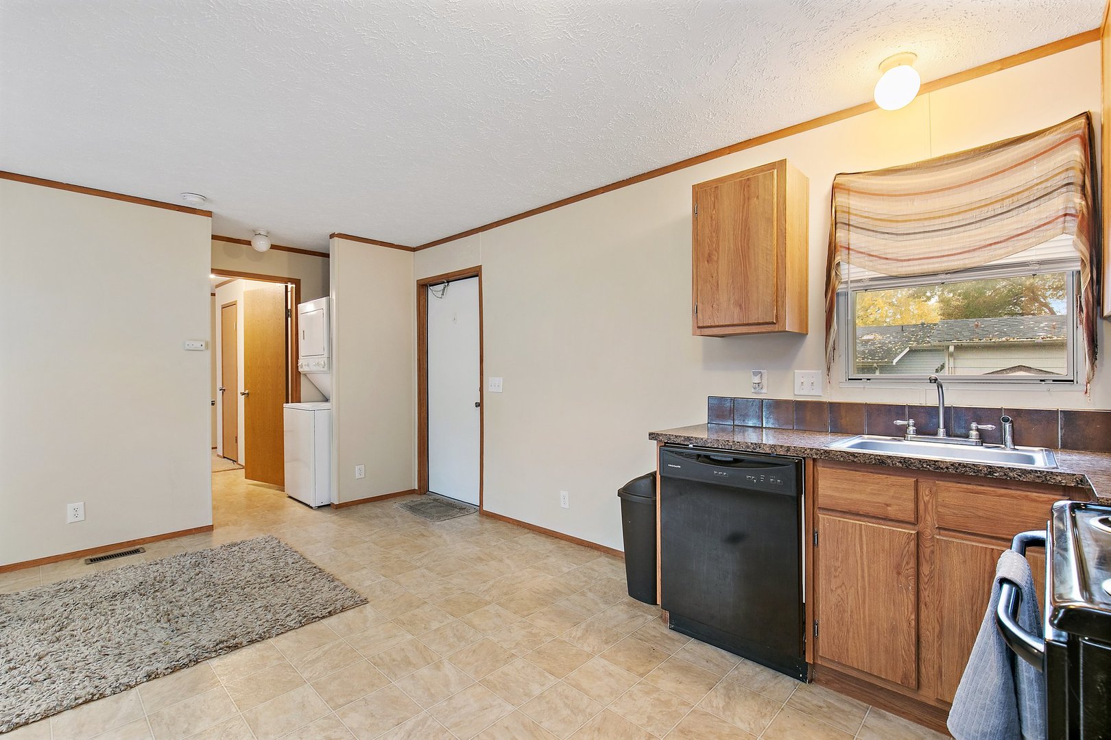 1187 Lakewood Road Elgin, IL 60123 - Photo 4 of 21 a kitchen with stainless steel appliances granite countertop a sink stove and cabinets