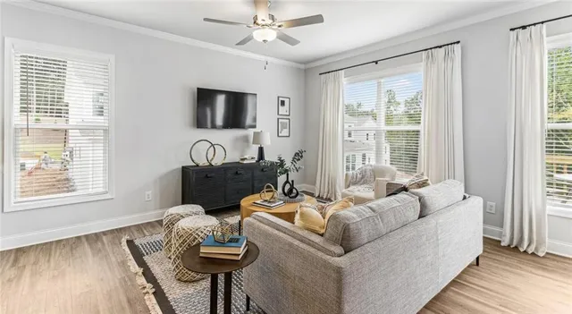 a living room with furniture and a flat screen tv