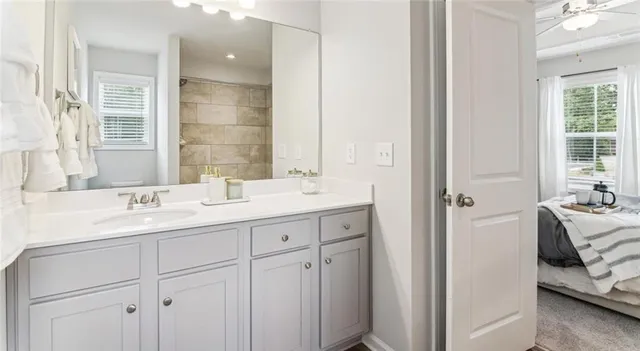 a bathroom with a double vanity sink and mirror