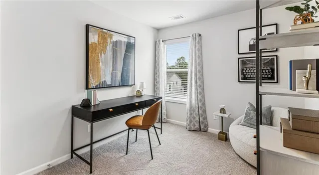 a bedroom with furniture and a window