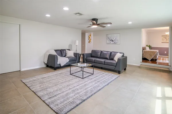 a living room with furniture and a rug