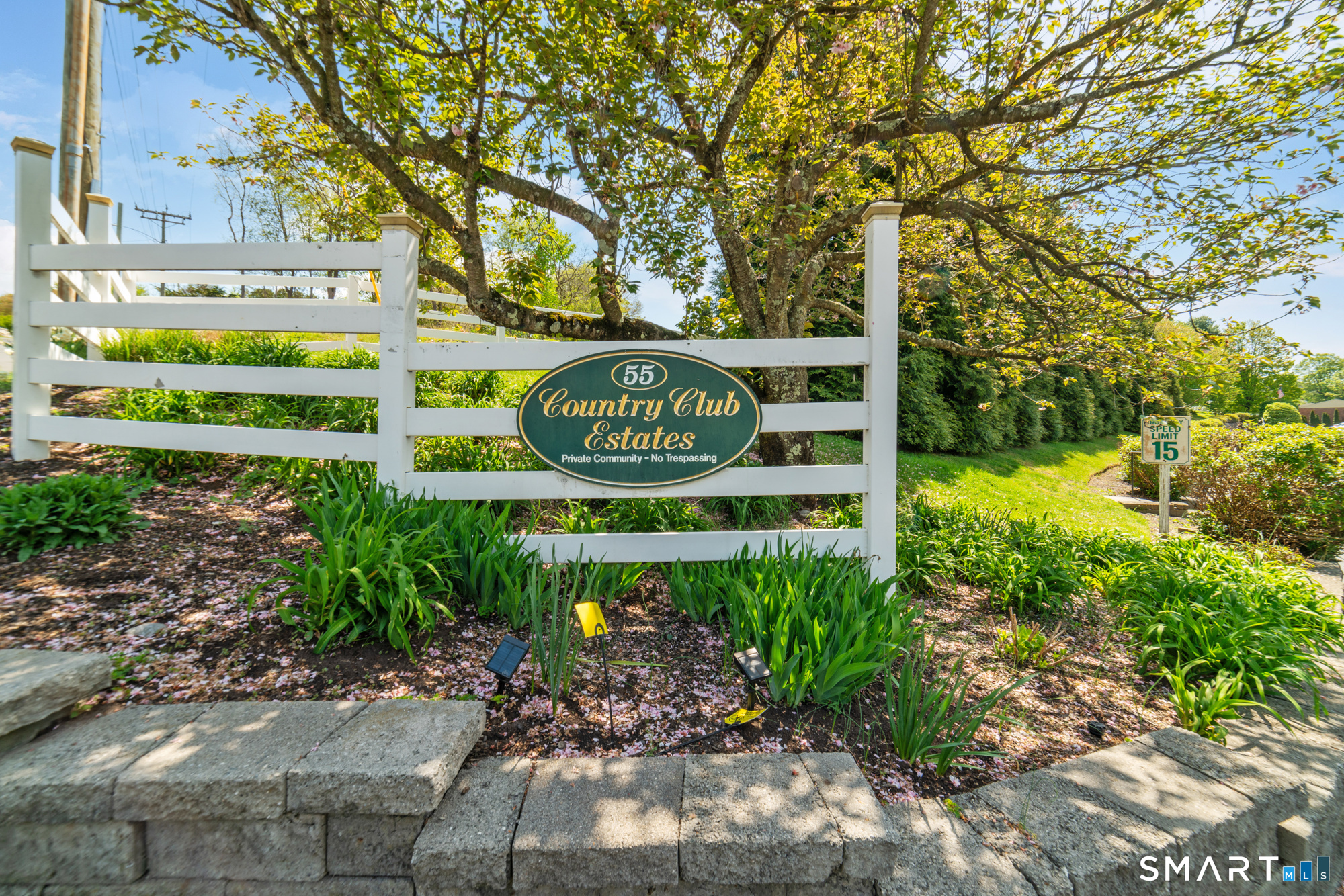 55 Porter Avenue, Unit 6E Naugatuck, CT 06770 - Photo 1 of 29 a sign that is sitting on a brick wall