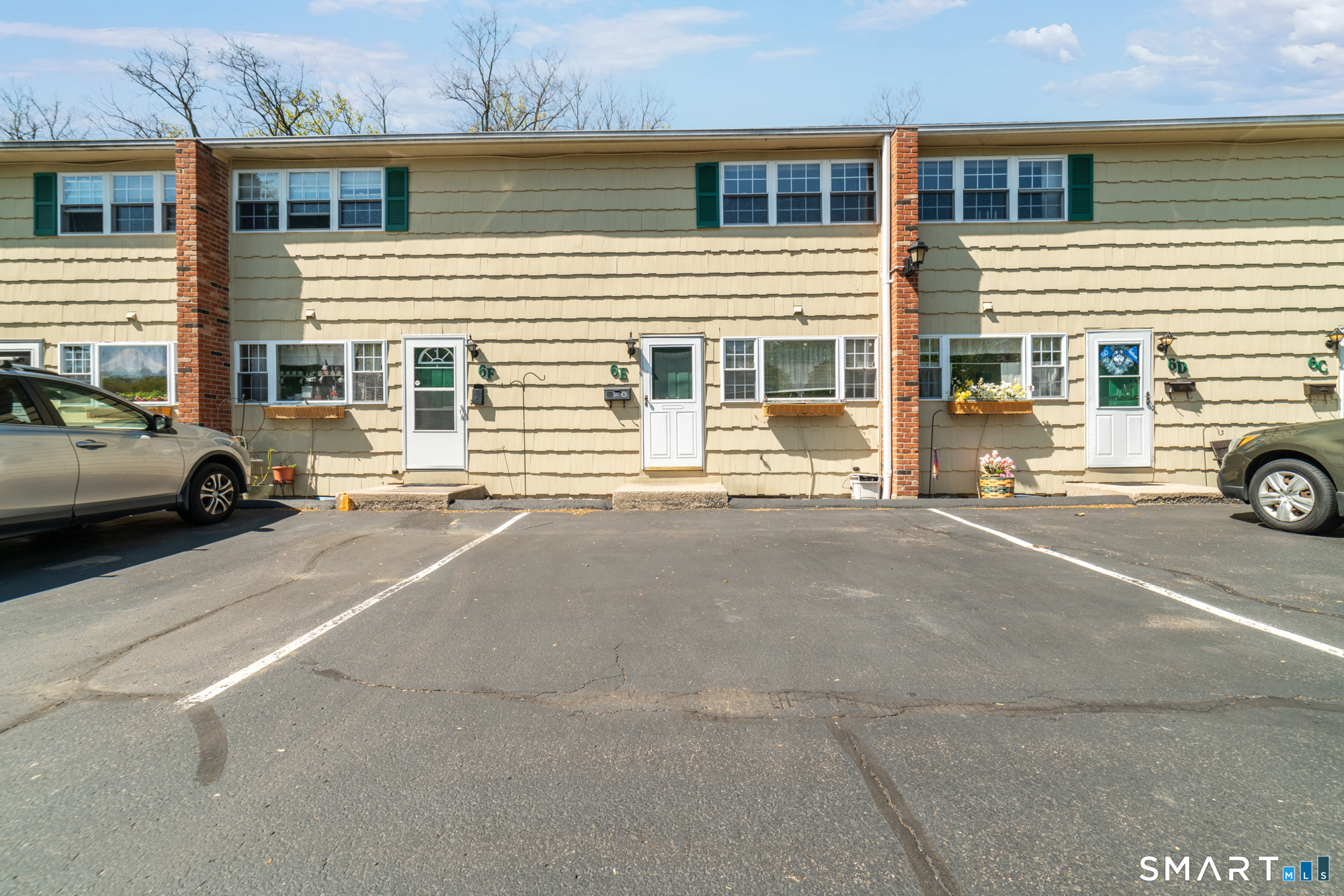 55 Porter Avenue, Unit 6E Naugatuck, CT 06770 - Photo 2 of 29 a view of a car parked in front of a building