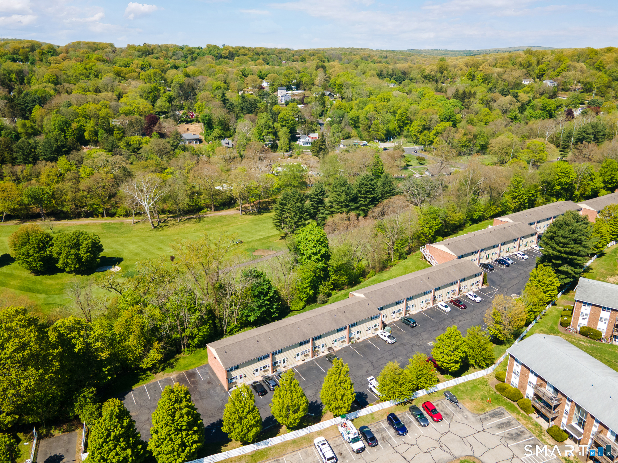 55 Porter Avenue, Unit 6E Naugatuck, CT 06770 - Photo 26 of 29 a view of a yard and an ocean