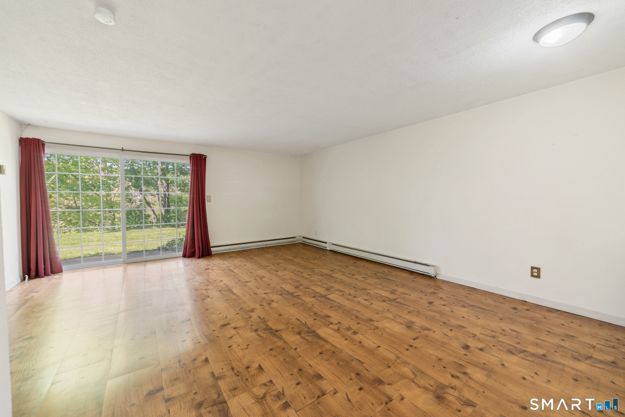 55 Porter Avenue, Unit 6E Naugatuck, CT 06770 - Photo 10 of 29 a view of an empty room with a window