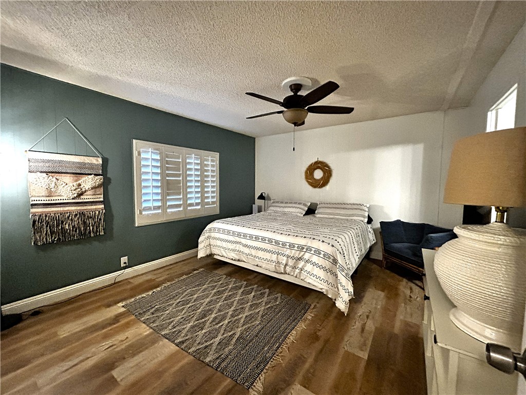 116 Thunderhead 1 Needles, CA 92363 - Photo 11 of 14 a bedroom with a large bed chandelier and a window
