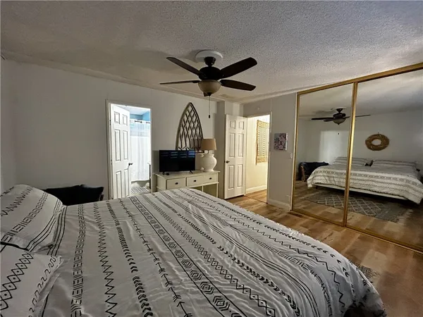 a bedroom with a bed and a view of bathroom