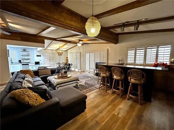 a living room with lots of furniture and a chandelier