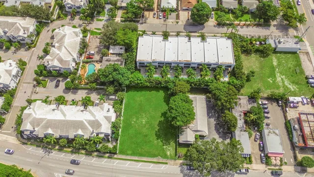 an aerial view of a house with garden space and lake view