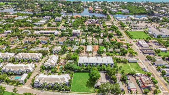 an aerial view of residential houses with outdoor space
