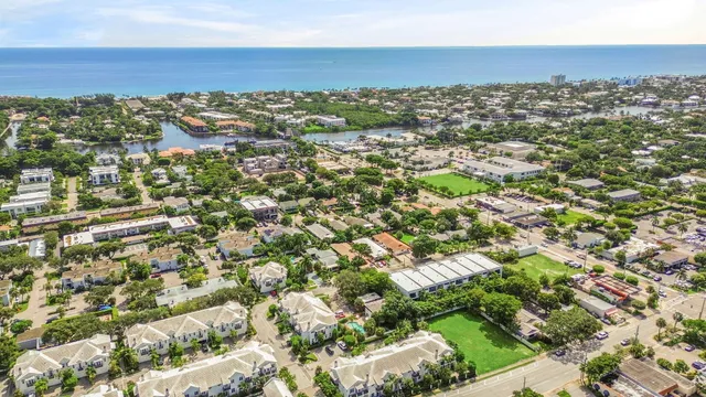 an aerial view of residential building and ocean view