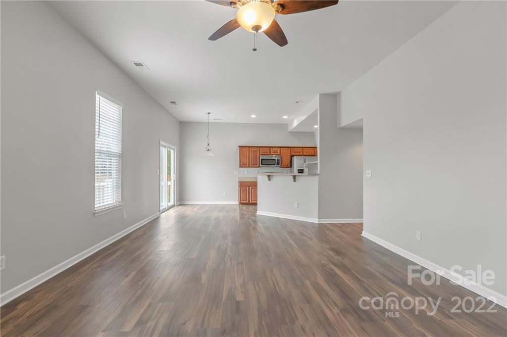 272 Lorraine Road Fort Mill, SC 29708 - Photo 19 of 42 a view of a kitchen with a dishwasher cabinets and wooden floor