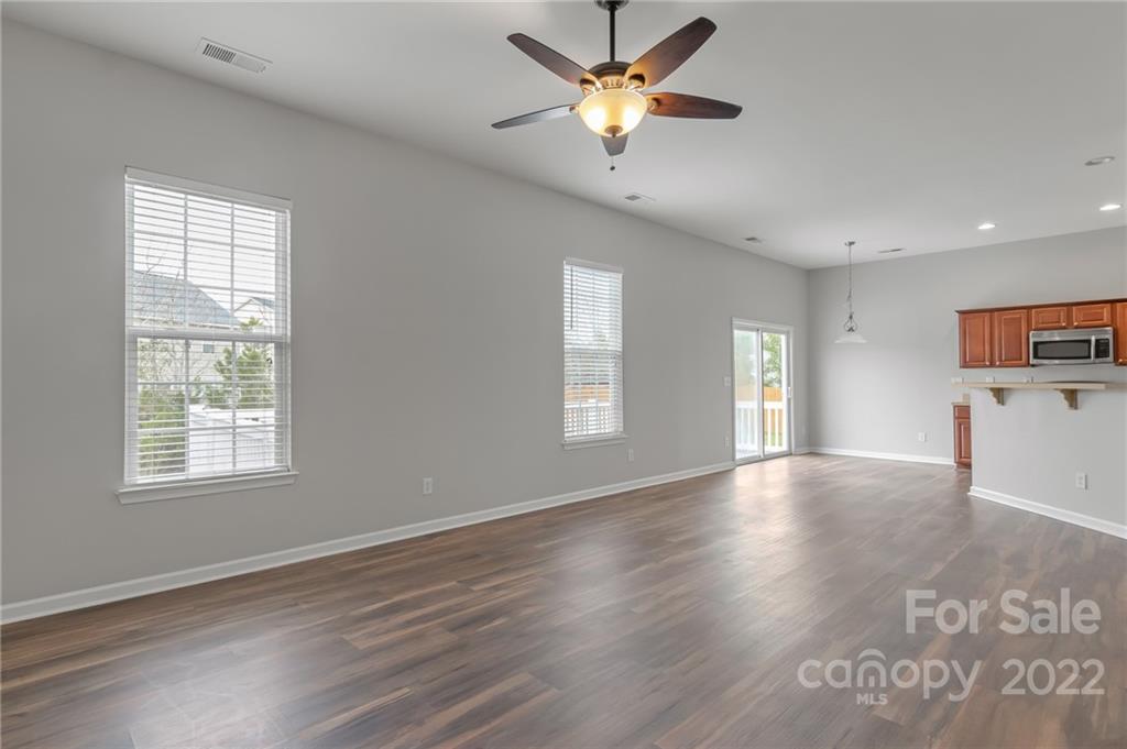 272 Lorraine Road Fort Mill, SC 29708 - Photo 20 of 42 a view of an empty room with a window and wooden floor