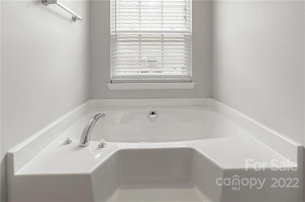 272 Lorraine Road Fort Mill, SC 29708 - Photo 32 of 42 a white bath tub sitting in a bathroom next to a window