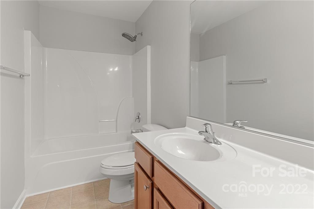 272 Lorraine Road Fort Mill, SC 29708 - Photo 35 of 42 a bathroom with a sink toilet vanity and shower
