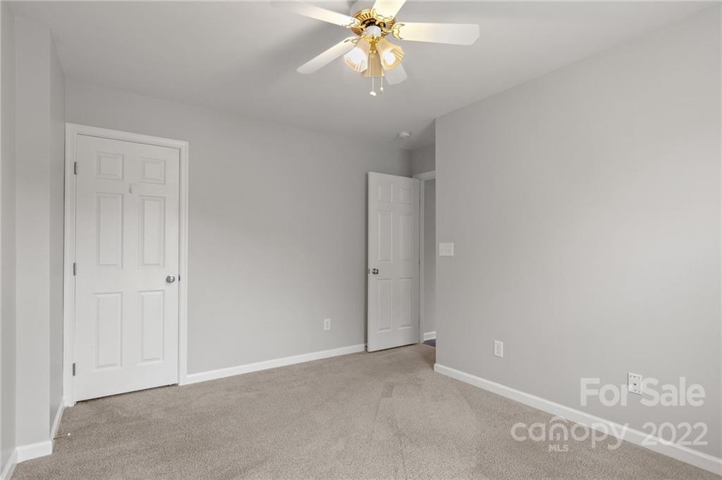 272 Lorraine Road Fort Mill, SC 29708 - Photo 37 of 42 an empty room with a ceiling fan and a window