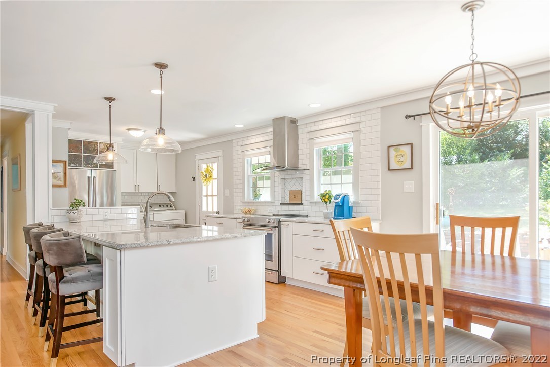 2611 Huntington Road Fayetteville, NC 28303 - Photo 11 of 33 a view of a kitchen and dining room