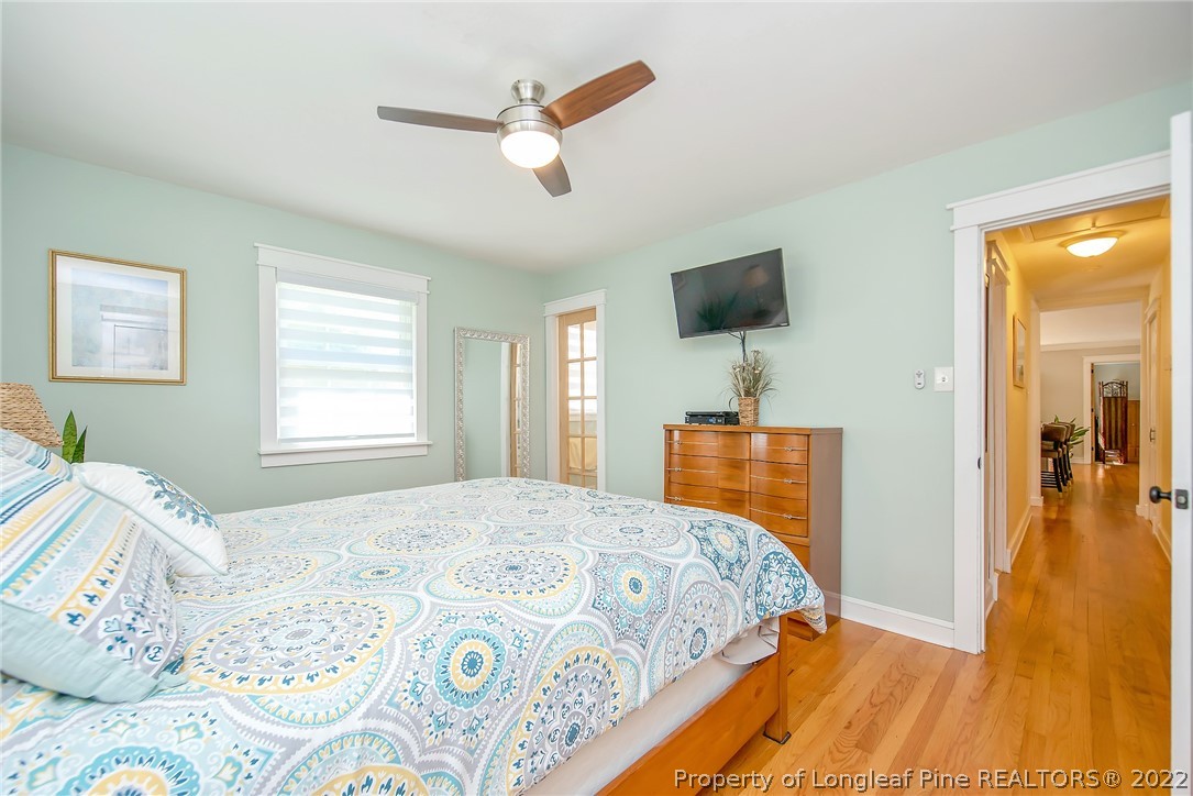 2611 Huntington Road Fayetteville, NC 28303 - Photo 23 of 33 a bedroom with a bed and a flat screen tv