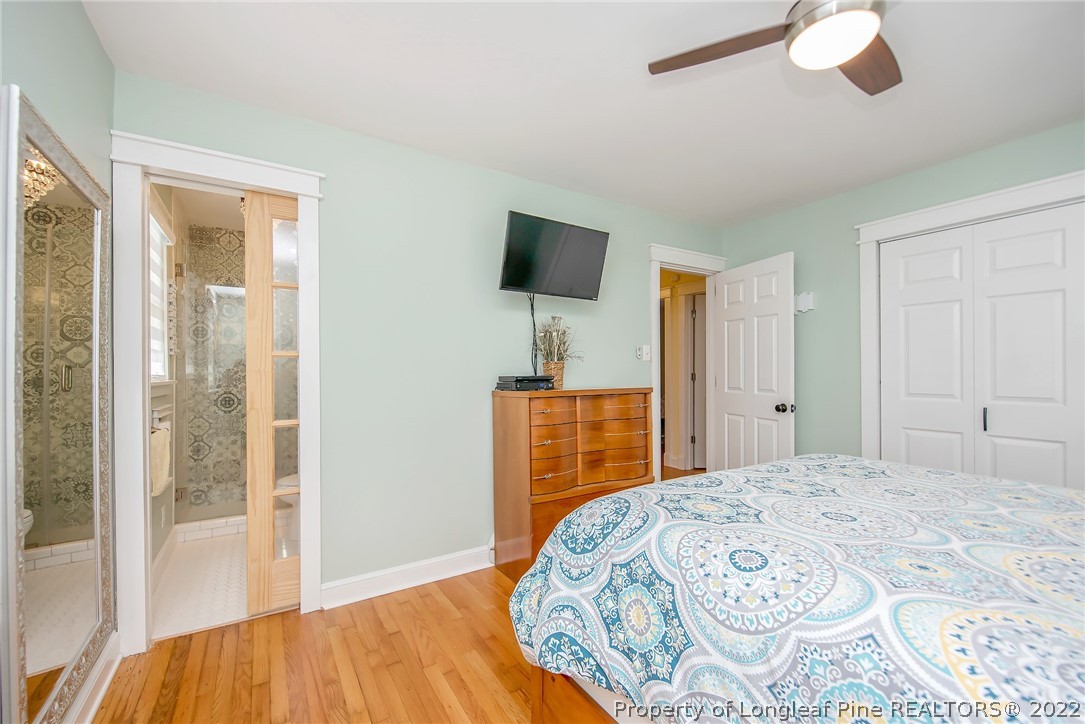2611 Huntington Road Fayetteville, NC 28303 - Photo 24 of 33 a bedroom with a bed and a flat screen tv