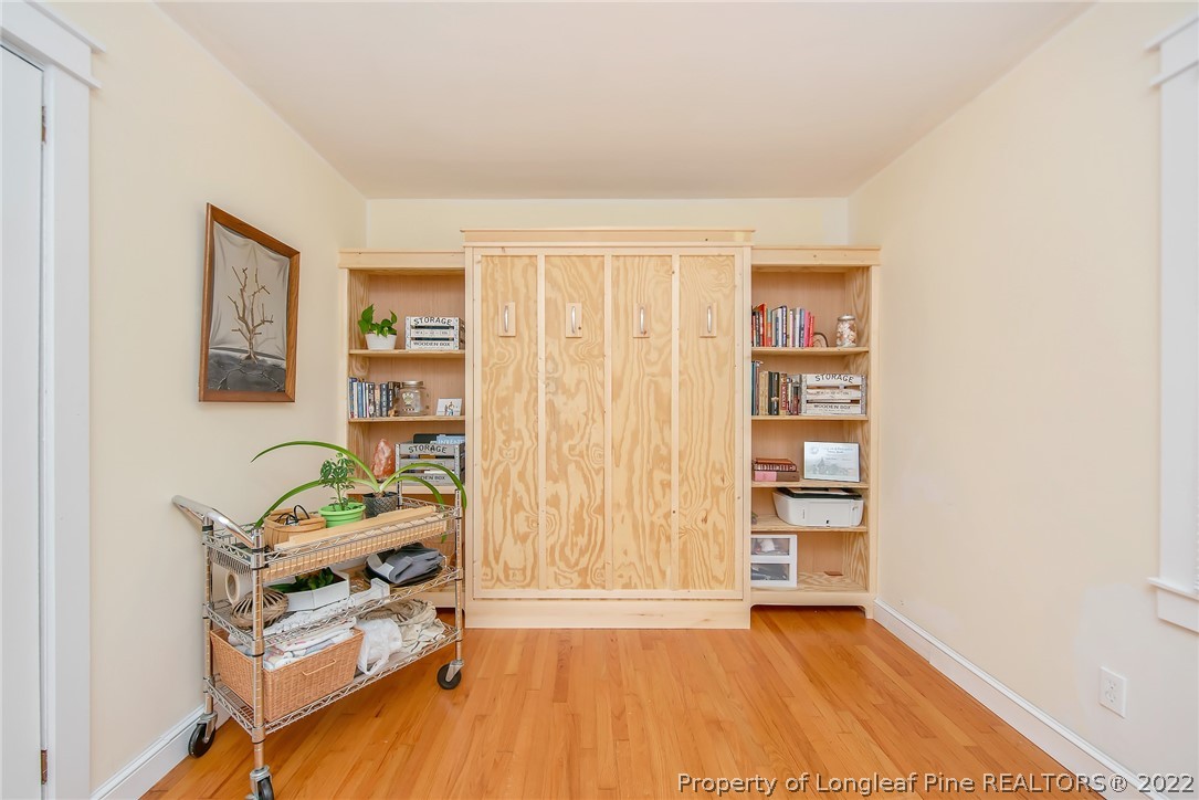 2611 Huntington Road Fayetteville, NC 28303 - Photo 29 of 33 a room with furniture and a wooden floor