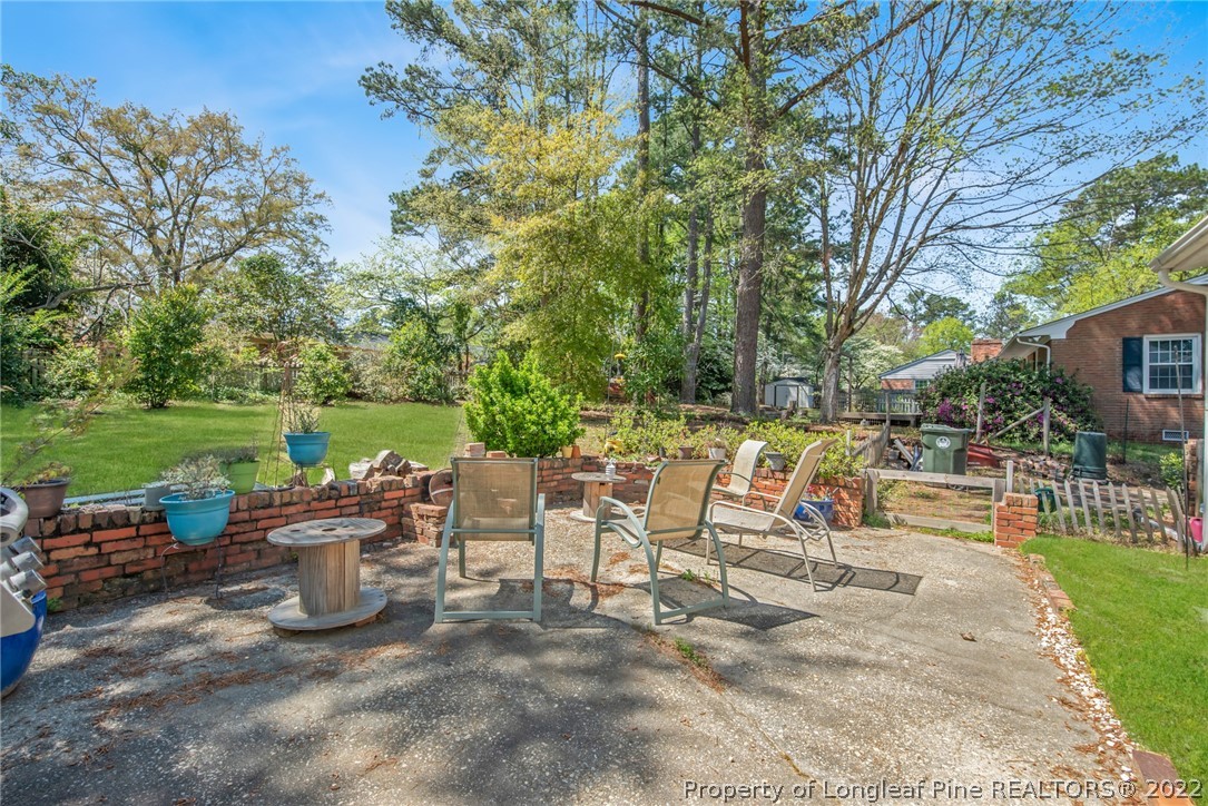 2611 Huntington Road Fayetteville, NC 28303 - Photo 31 of 33 a view of a chairs and table in backyard