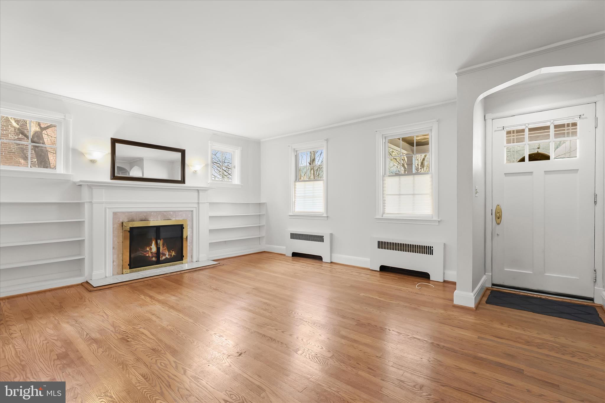 67 Dunkirk Road Baltimore, MD 21212 - Photo 7 of 57 a view of a livingroom with furniture a fireplace and wooden floor