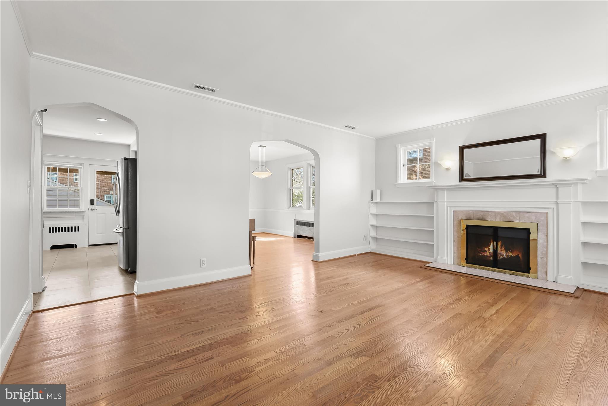 67 Dunkirk Road Baltimore, MD 21212 - Photo 9 of 57 a view of a livingroom with wooden floor and a fireplace