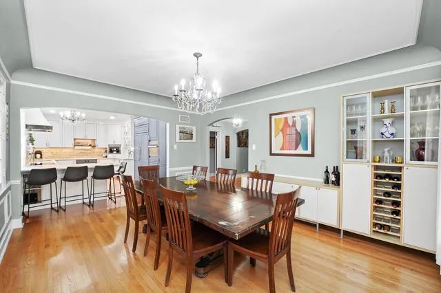 a kitchen with a refrigerator and a stove top oven