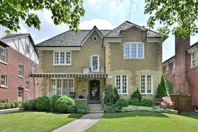 front view of a house with a yard