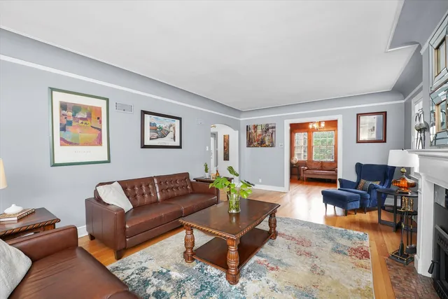 a view of a dining room with furniture wooden floor and chandelier