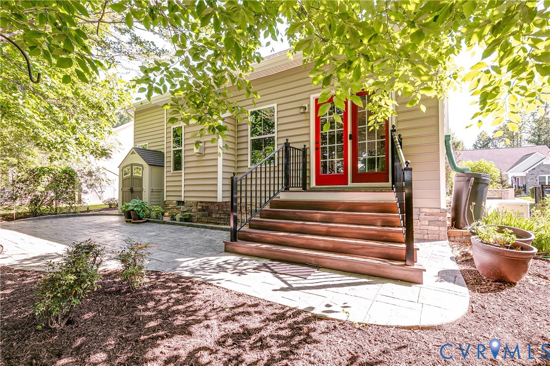 7538 South Franklins Way Quinton, VA 23141 - Photo 41 of 48 a front view of a house with a garden and plants